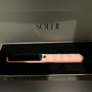 A Soleil styling comb, hair mask, shampoo, conditioner, and hair oil.